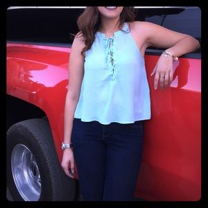 Lace up front sleeveless blouse